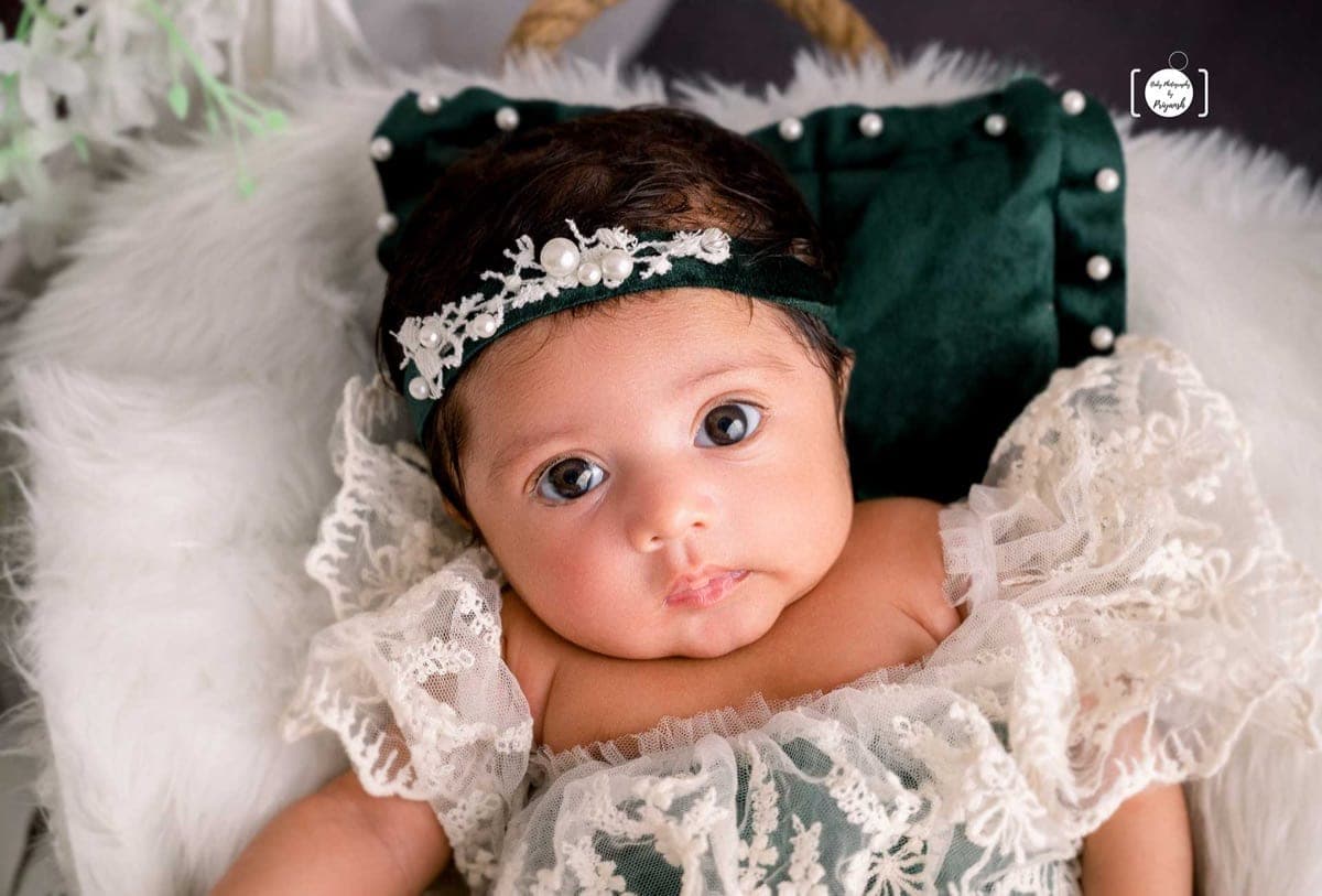 Newborn photoshoot preview — a peacefully sleeping newborn in Delhi NCR studio by Priyansh Bhardwaj.